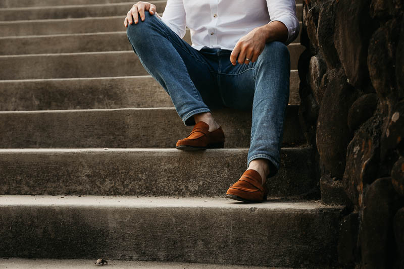 Wolf and Shepherd model sitting on steps with monaco loafers